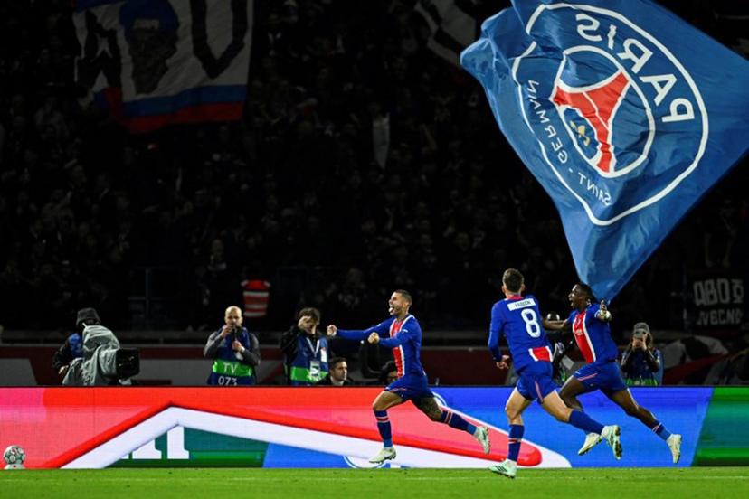 PSG's French defender #21 Lucas Hernandez (L) celebrates after scoring his team's second goal during the UEFA Champions League first round day 3 football match between Paris Saint-Germain (PSG) and FC Barcelona at the Parc de Princes stadium in Paris on October 20, 2026. JULIEN DE ROSA / AFP