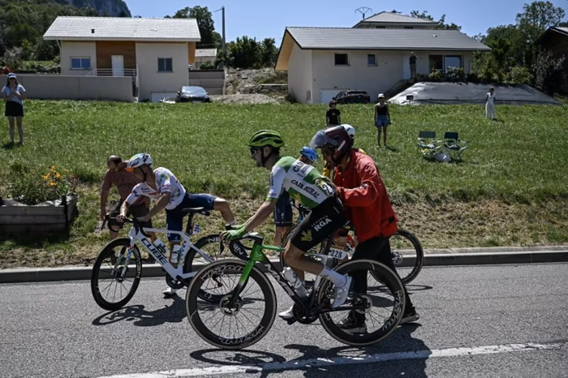 TotalEnergies team's French rider Alexandre Delettre and Caja Rural - Seguros RGA team's Spanish rider Jose Felix Parra receive assistance after a crash during the 17th stage of the 113th edition of the Tour de France cycling race, 174,7 km between Chambéry and Voiron in the French Alps, on July 22, 2026. Loic VENANCE / AFP