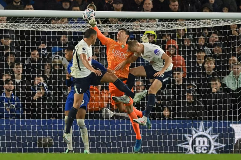 Chelsea's Belgian goalkeeper #39 Mike Penders punches the ball into his own net for an own-goal, Tottenham's opening goal during the English Premier League football match between Chelsea and Tottenham Hotspur at Stamford Bridge in London on October 24, 2026. Glyn KIRK / AFP