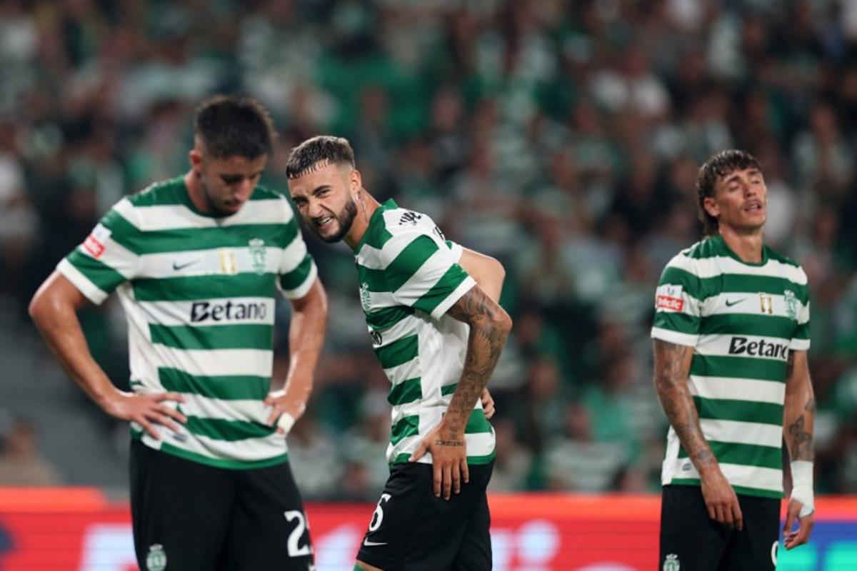 Sporting Lisbon's Portuguese defender #25 Goncalo Inacio (L), Belgian defender #06 Zeno Debast (C), and Portuguese defender #11 Nuno Santos react after losing during the Portuguese League football match between Sporting CP and FC Porto at the Jose Alvalade stadium in Lisbon, on August 30, 2025. PATRICIA DE MELO MOREIRA / AFP
