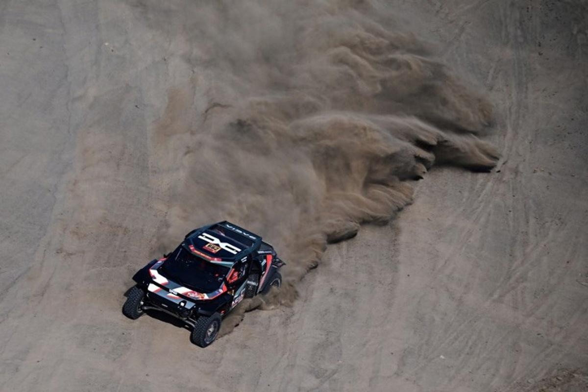 Dacia Sandriders' Qatari driver Nasser al-Attiyah and Belgian co-driver Fabian Lurquin compete in the Stage 1 of the 48th edition of the Dakar Rally 2026, between Yanbu and Yanbu, Saudi Arabia, on January 4, 2026. Giuseppe CACACE / AFP
