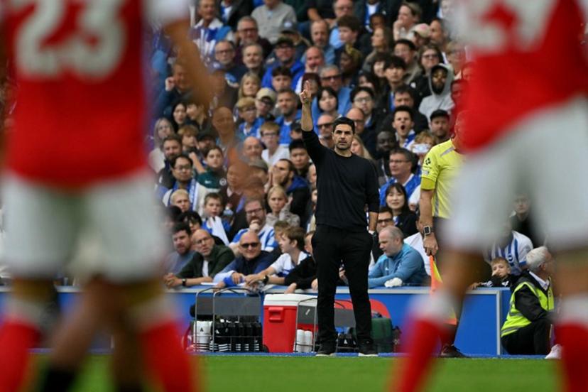 Arsenal's Spanish manager Mikel Arteta watches the players from the touchline during the English Premier League football match between Brighton and Hove Albion and Arsenal at the American Express Community Stadium in Brighton, southern England on September 19, 2026. Glyn KIRK / AFP