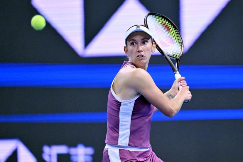 Belgium's Elise Martens hits a return to China's Zheng Qinwen during their women's singles semi-final at the China Open tennis tournament in Beijing on October 10, 2026. Adek BERRY / AFP