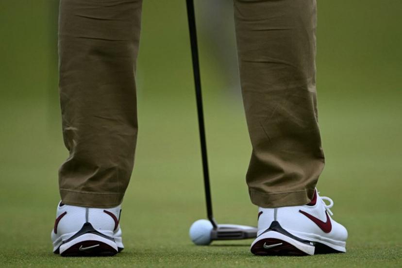 Northern Ireland's Rory McIlroy putts on the 12th green during a practice round ahead of the 152nd British Open Golf Championship at Royal Troon on the south west coast of Scotland on July 17, 2024. ANDY BUCHANAN / AFP