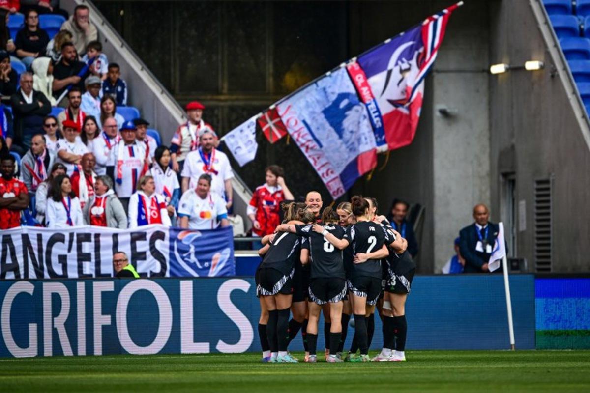 Arsenal's players celebrate after scoring a goal during the UEFA Women's Champions League semi-final second leg football match between Lyon and Arsenal at the Groupama Stadium in Decines-Charpieu, central-eastern France on April 27, 2025. OLIVIER CHASSIGNOLE / AFP