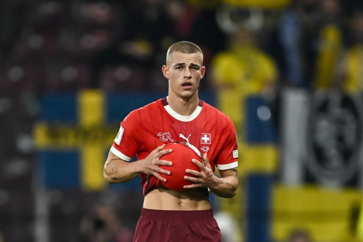 Switzerland's defender #2 Miro Muheim holds the ball during the FIFA World Cup 2026 Group B European qualification football match between Switzerland and Sweden at the Geneva stadium, in Geneva, on November 15, 2025. Fabrice COFFRINI / AFP