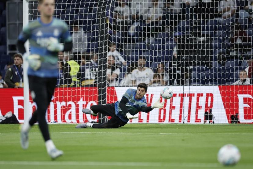 Real Madrid's Belgian goalkeeper #01 Thibaut Courtois warms up before the Spanish league football match between Real Madrid CF and Real Oviedo at Santiago Bernabeu Stadium in Madrid on May 14, 2026. Oscar DEL POZO / AFP
