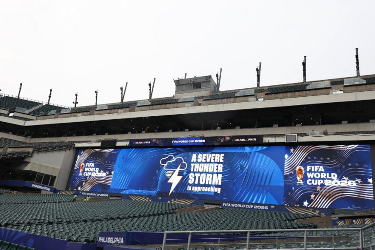 A jumbotron informs about a thunderstorm approaching ahead of the 2026 World Cup Group I football match between France and Iraq at the Philadelphia Stadium in Philadelphia on June 22, 2026. FRANCK FIFE / AFP