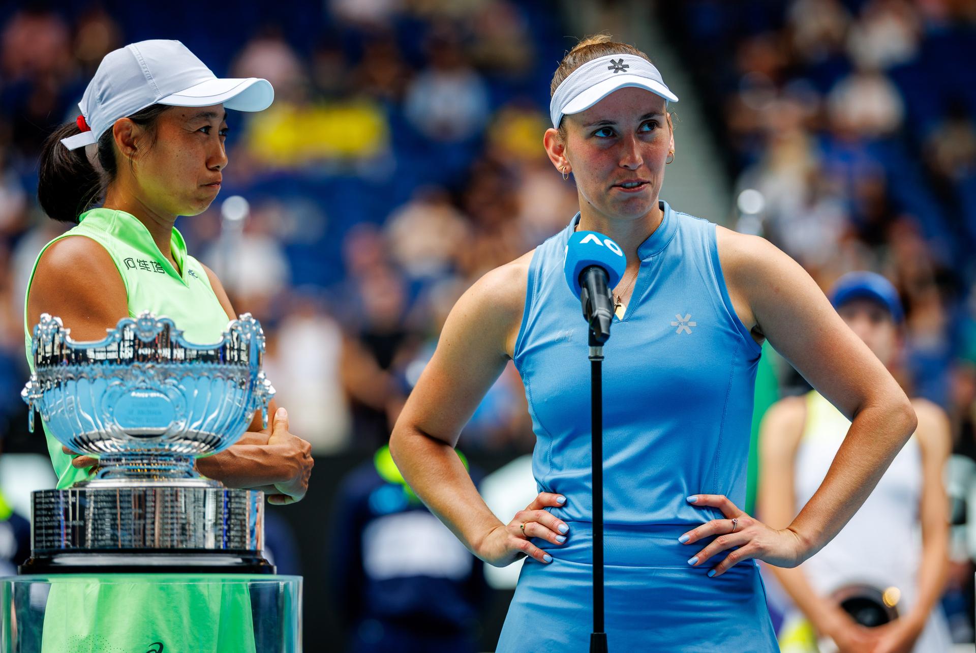 Belgian Elise Mertens and Chinese Shuai Zhang celebrate after winning a doubles tennis match between Belgian-Chinese pair Mertens-Zhang and Kazakh/Serbian pair Danilina/Krunic, in the final of the women doubles at the Australian Open, Melbourne Park, Melbourne on Saturday 31 January 2026. BELGA PHOTO PATRICK HAMILTON --- BENELUX ONLY ---