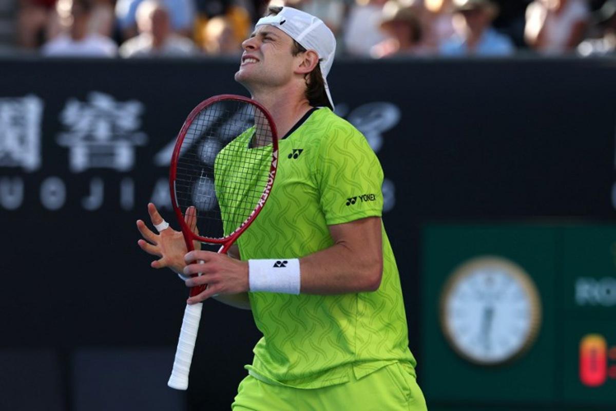 Belgium's Zizou Bergs reacts after a point against Poland's Hubert Hurkacz during their men's singles match on day three of the Australian Open tennis tournament in Melbourne on January 20, 2026. IZHAR KHAN / AFP