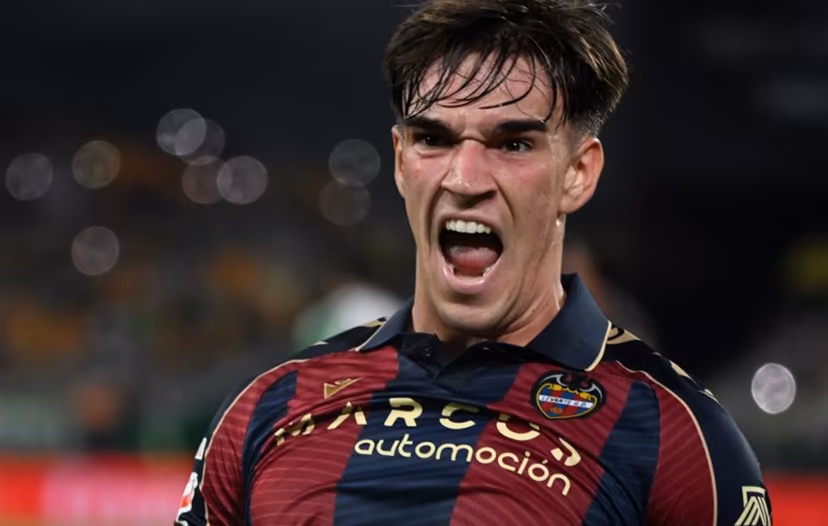 Levante's Spanish forward #19 Carlos Espi Escrihuela celebrates scoring his team's first goal during the Spanish league football match between Real Betis and Levante UD at Benito Villamarin Stadium in Seville on May 23, 2026. CRISTINA QUICLER / AFP