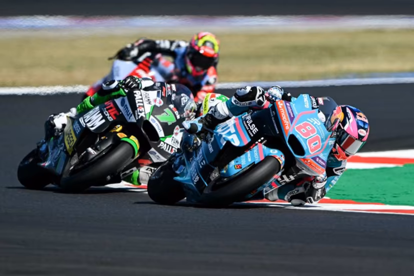 REDS Fantic Racing's Belgian rider Barry Baltus (C) and CFMOTO Aspar European Privilege Team's Colombian rider David Alonso compete during the qualifying session for the Moto2 race as part of the Misano World Circuit Marco Simoncelli, in Misano Adriatico, northern Italy on September 12, 2026. Andreas SOLARO / AFP