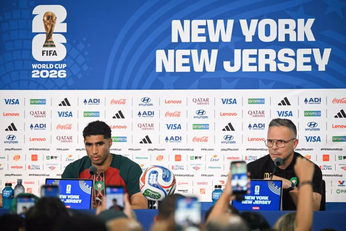 Morocco's head coach Mohamed Ouahbi (R) speaks alongside Morocco's Achraf Hakimi during a press conference at the New York/New Jersey Stadium in East Rutherford on June 12, 2026, on the eve of the 2026 World Cup football match between Brazil and Morocco. Mauro PIMENTEL / AFP