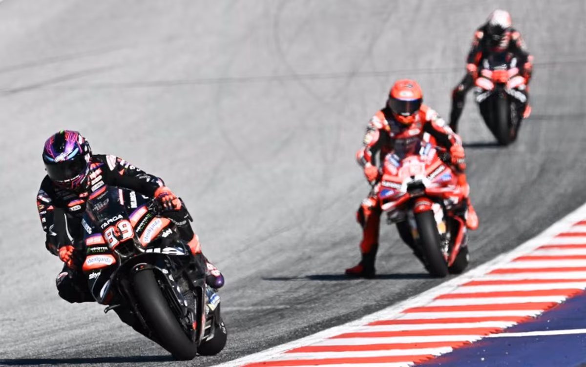 Aprilia Racing's Spanish driver Jorge Martin (L) and Ducati Lenovo Team's Spanish driver Marc Marquez compete during the Sprint event of the Grand Prix of Austria MotoGP in Spielberg bei Knittelfeld, Austria, on September 19, 2026. Joe Klamar / AFP