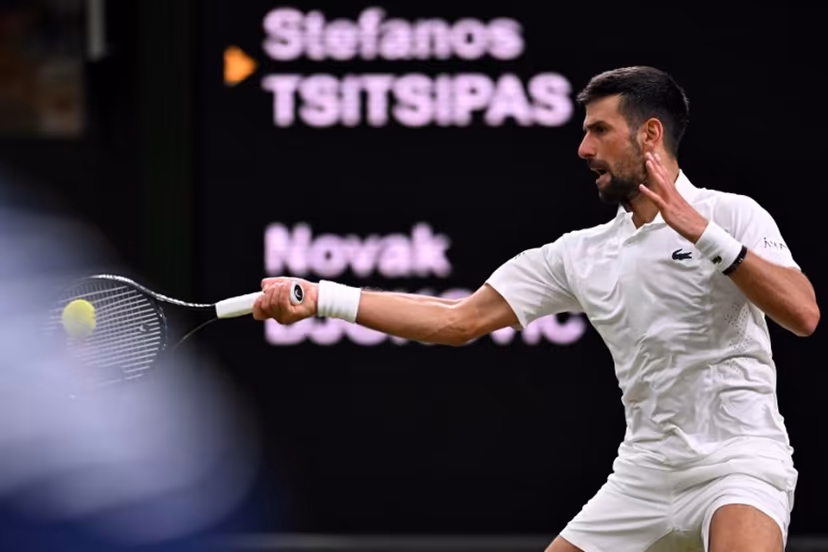 Serbia's Novak Djokovic returns the ball to Greece's Stefanos Tsitsipas during their men's singles second round tennis match on the third day of the 2026 Wimbledon Championships at The All England Lawn Tennis and Croquet Club in Wimbledon, southwest London, on July 1, 2026. Kirill KUDRYAVTSEV / AFP