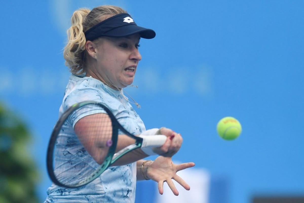 Russia's Anna Blinkova hits a return to Czech Republic's Dominika Salkova during their women's singles semi-final match at the Jiangxi Open tennis tournament in Jiujiang, central China's Jiangxi province on November 1, 2025. STR / AFP
