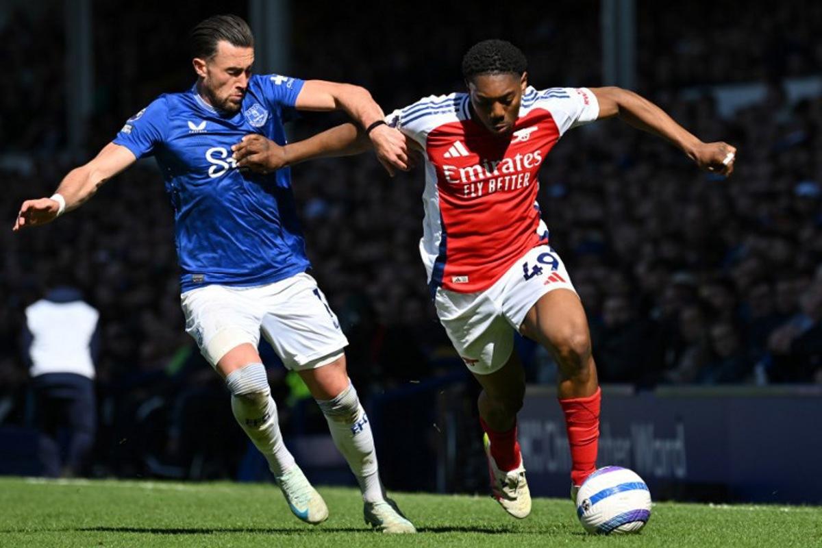 Everton's English striker #11 Jack Harrison (L) vies with Arsenal's English midfielder #49 Myles Lewis-Skelly (R) during the English Premier League football match between Everton and Arsenal at Goodison Park in Liverpool, north west England on April 5, 2025. ANDY BUCHANAN / AFP