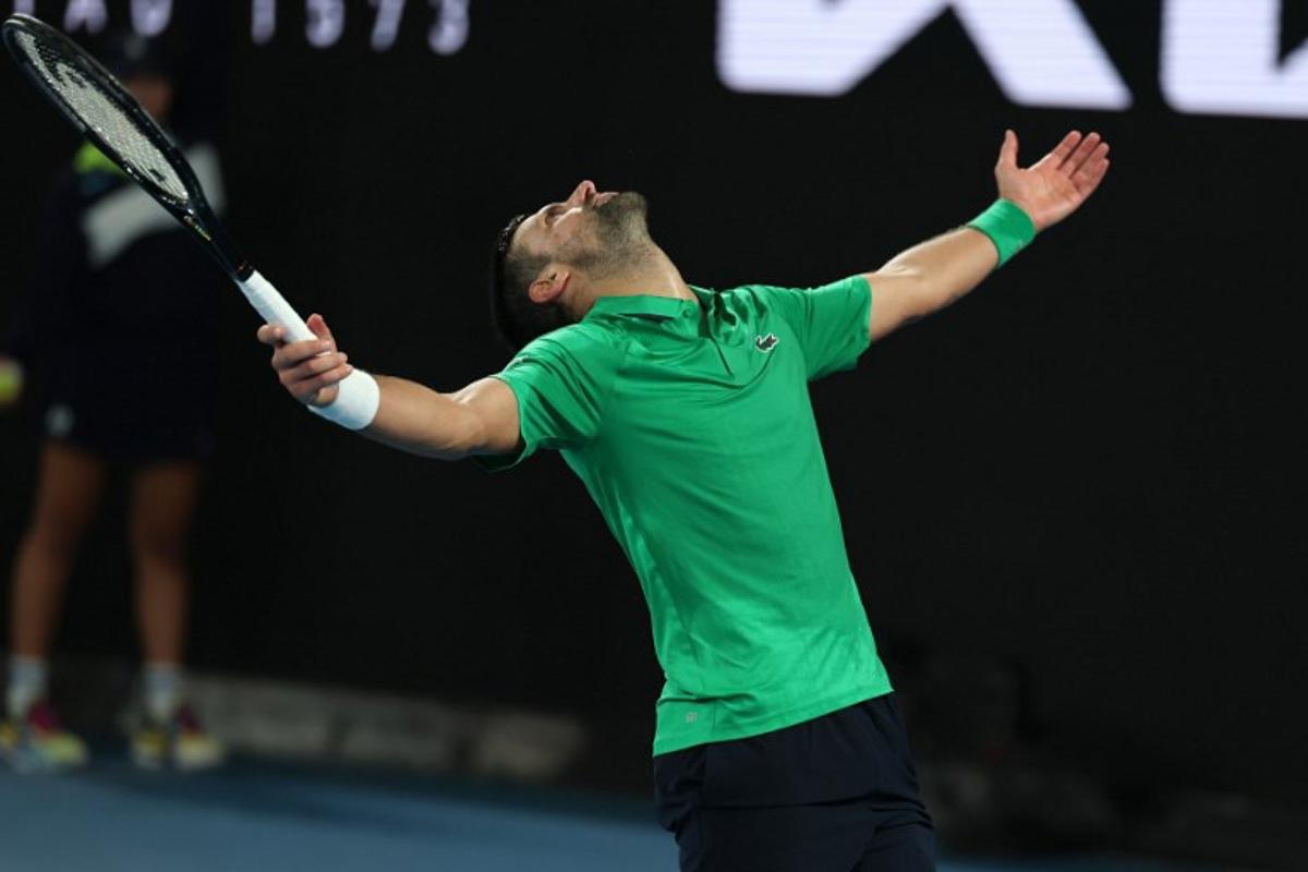 Serbia's Novak Djokovic reacts on a point to Italy's Jannik Sinner during their men's singles semi-final match on day thirteen of the Australian Open tennis tournament in Melbourne on January 31, 2026. Martin KEEP / AFP