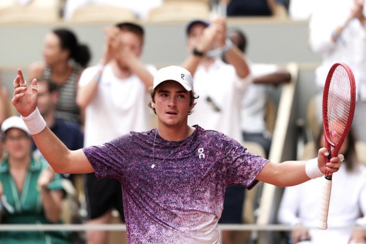 Brazil's Joao Fonseca reacts after winning a game as he plays against Serbia's Novak Djokovic during their men's singles match on day 6 of the French Open tennis tournament on Court Philippe-Chatrier at the Roland-Garros Complex in Paris on May 29, 2026. Dimitar DILKOFF / AFP
