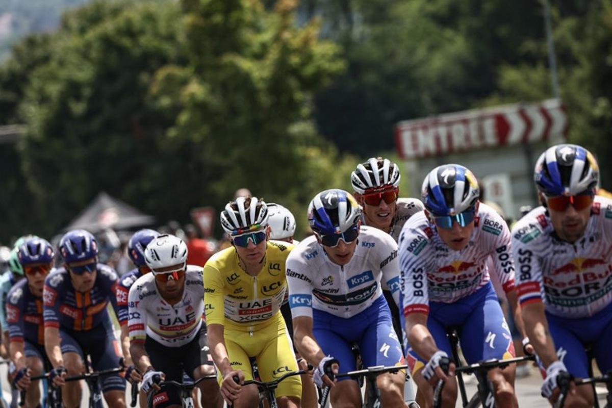 (From 3rd L) UAE Team Emirates - XRG team's Ecuadorian rider Jhonatan Narvaez, UAE Team Emirates - XRG team's Slovenian rider Tadej Pogacar wearing the overall leader's yellow jersey, Red Bull - BORA - hansgrohe team's German rider Florian Lipowitz wearing the best young rider's white jersey, UAE Team Emirates - XRG team's German rider Nils Politt cycle with the pack of riders (peloton) during the 20th stage of the 112th edition of the Tour de France cycling race, 184.2 km between Nantua and Pontarlier, in the Jura, eastern France, on July 26, 2025. Anne-Christine POUJOULAT / AFP