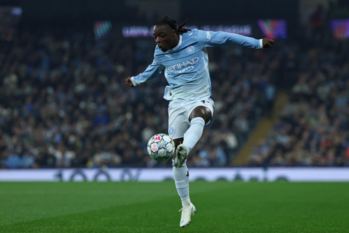 Manchester City's Belgian midfielder #11 Jeremy Doku controls the ball during the UEFA Champions League, league phase football match between Manchester City and Paris Saint Germain at the Etihad Stadium in Manchester, north west England, on October 14, 2026. FRANCK FIFE / AFP