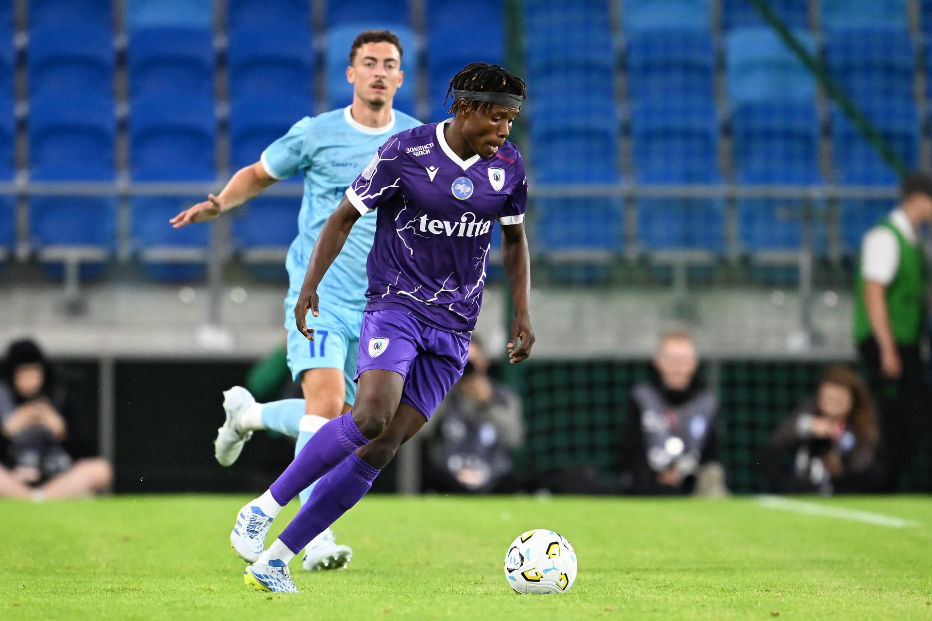 Gent's Mathias Delorge and Cherkasy's Adam Yakubu pictured in action during a soccer game between Ukrainian FC LNZ Cherkasy and Belgian KAA Gent, Thursday 23 July 2026 in Plock, Poland, the first leg of the second qualifying round for the UEFA Conference League. BELGA PHOTO JILL DELSAUX