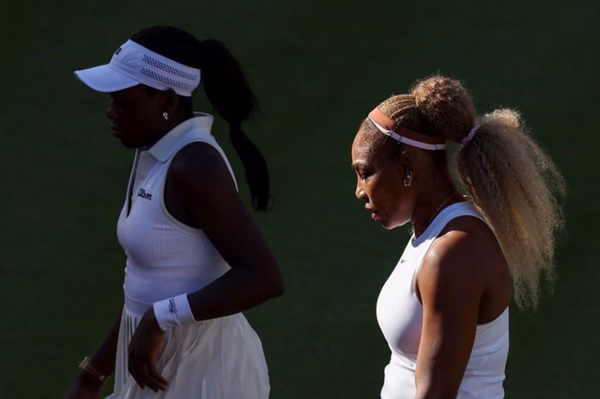 US player Serena Williams (R) walks with Canada's Victoria Mboko (L) while playing against US player Nicole Melichar-Martinez and New Zealand's Erin Routliffe during their round of 16, doubles match at the HSBC WTA tennis Championships at Queen's Club in west London on June 9, 2026. Adrian Dennis / AFP