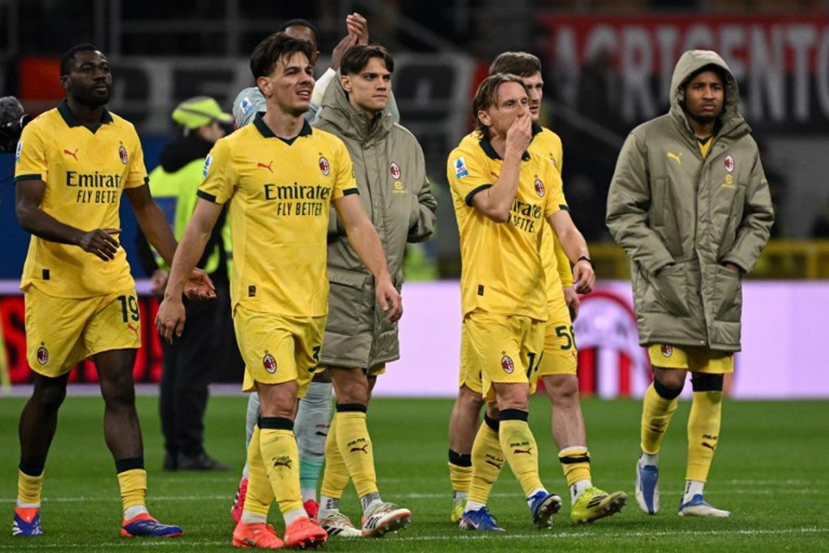(From L) AC Milan's French midfielder #19 Youssouf Fofana, AC Milan's Italian midfielder #04 Samuele Ricci, AC Milan's Italian midfielder #04 Samuele Ricci, AC Milan's Croatian midfielder #14 Luka Modric and AC Milan's French forward #18 Christopher Nkunku react at the end of the Italian Serie A football match between AC Milan and Como at the San Siro Stadium in Milan, northern Italy, on February 18, 2026. Piero CRUCIATTI / AFP