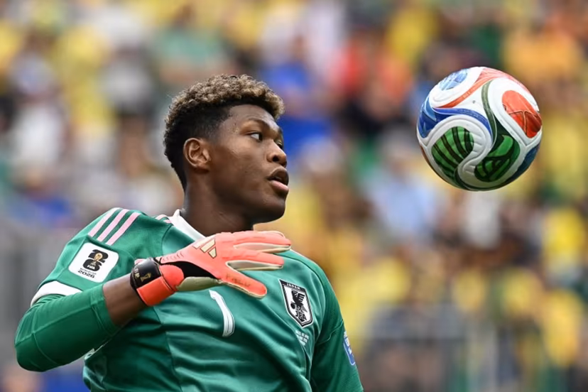 (FILES) Japan's goalkeeper Zion Suzuki eyes the ball during the 2026 World Cup round of 32 football match between Brazil and Japan at the Houston Stadium in Houston on June 29, 2026. Zion Suzuki has had to overcome costly mistakes and racist abuse on the way to becoming the most expensive Japanese goalkeeper in history. The 23-year-old is reportedly set to join Premier League Aston Villa from Italian team Parma for up to 35 million euros ($40 million) following an impressive World Cup. Paul ELLIS / AFP