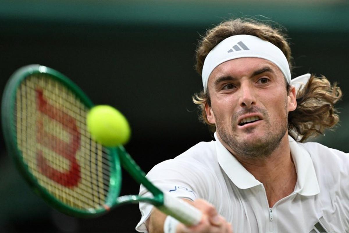 Greece's Stefanos Tsitsipas returns to Serbia's Novak Djokovic during their men's singles second round tennis match on the third day of the 2026 Wimbledon Championships at The All England Lawn Tennis and Croquet Club in Wimbledon, southwest London, on July 1, 2026. Kirill KUDRYAVTSEV / AFP