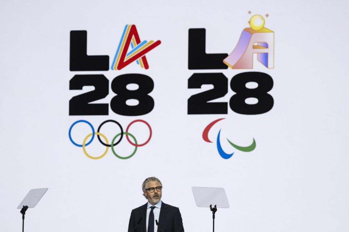 Los Angeles 2028 Olympics chairman, Casey Wasserman speaks during the presentation of an activities report during the 144th session of the International Olympic Committee (IOC), in Costa Navarino, Greece, on the election day of the next IOC President, on March 20, 2025. Fabrice COFFRINI / AFP