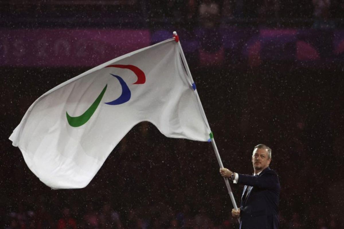 President of the International Paralympic Committee (IPC) Andrew Parsons waves the Paralympics flag during the Paris 2024 Paralympic Games Closing Ceremony at the Stade de France, in Saint-Denis, in the outskirts of Paris, on September 8, 2024. Thibaud Moritz / AFP
