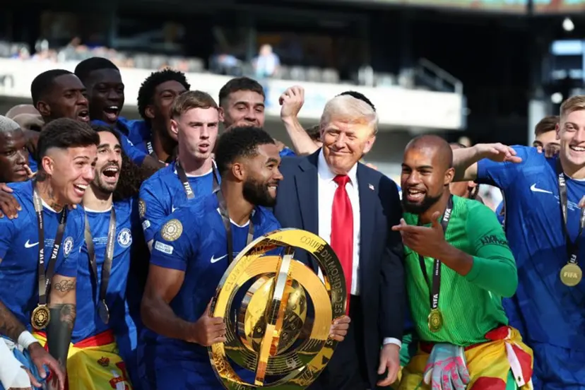 Chelsea's Reece James holds the trophy as he celebrates with teammates and US President Donald Trump after Chelsea won against Paris St Germain in the FIFA Club World Cup final, at the MetLife Stadium in East Rutherford, New Jersey on July 13, 2025. Kevin Lamarque / POOL / AFP