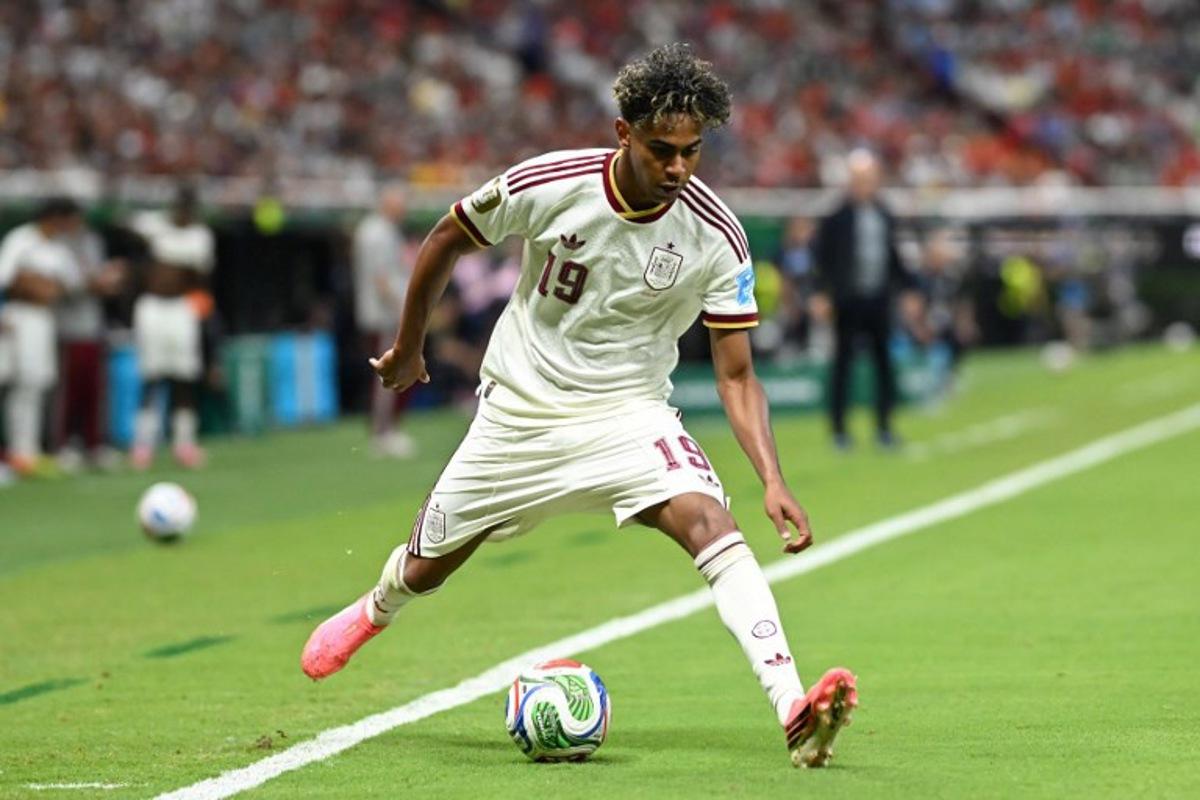Spain's forward #19 Lamine Yamal controls the ball during the 2026 World Cup Group H football match between Uruguay and Spain at the Guadalajara Stadium in Zapopan on June 26, 2026. CARL DE SOUZA / AFP
