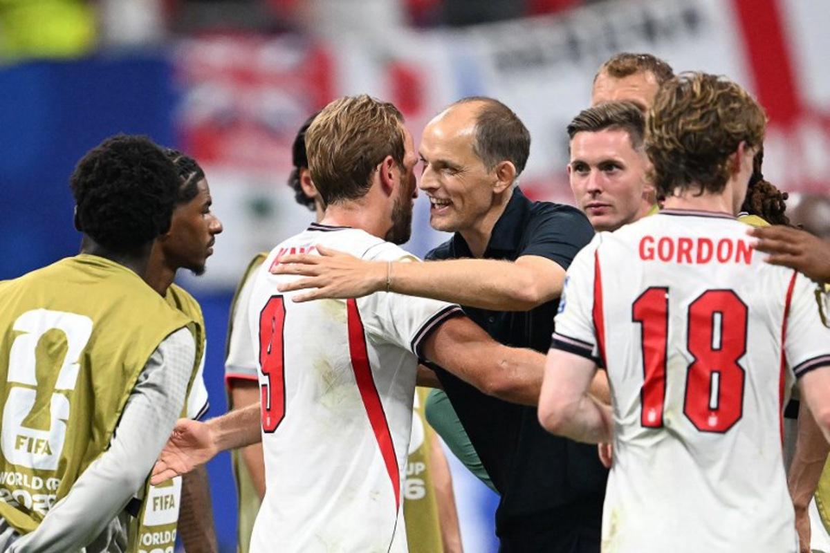 England's forward #09 Harry Kane celebrates with England's German head coach Thomas Tuchel after winning the 2026 World Cup round of 32 match football between England and the Democratic Republic of Congo at the Atlanta Stadium in Atlanta on July 1, 2026. ROBERTO SCHMIDT / AFP