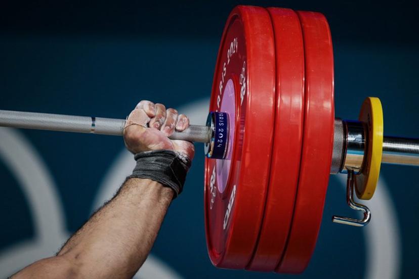 Estonia's Mart Seim competes in the men's +102kg weightlifting event during the Paris 2024 Olympic Games at the South Paris Arena in Paris, on August 10, 2024. JEFF PACHOUD / AFP