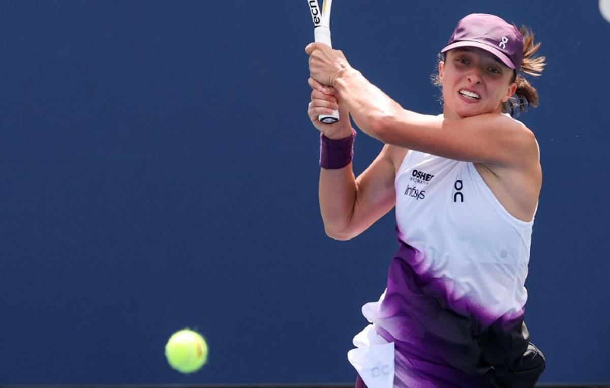 Poland's Iga Swiatek hits a return to Argentina's Nadia Podoroska during their women's singles second round tennis match on day five of the US Open tennis tournament at the USTA Billie Jean King National Tennis Center in New York City on September 3, 2026. TIMOTHY A. CLARY / AFP