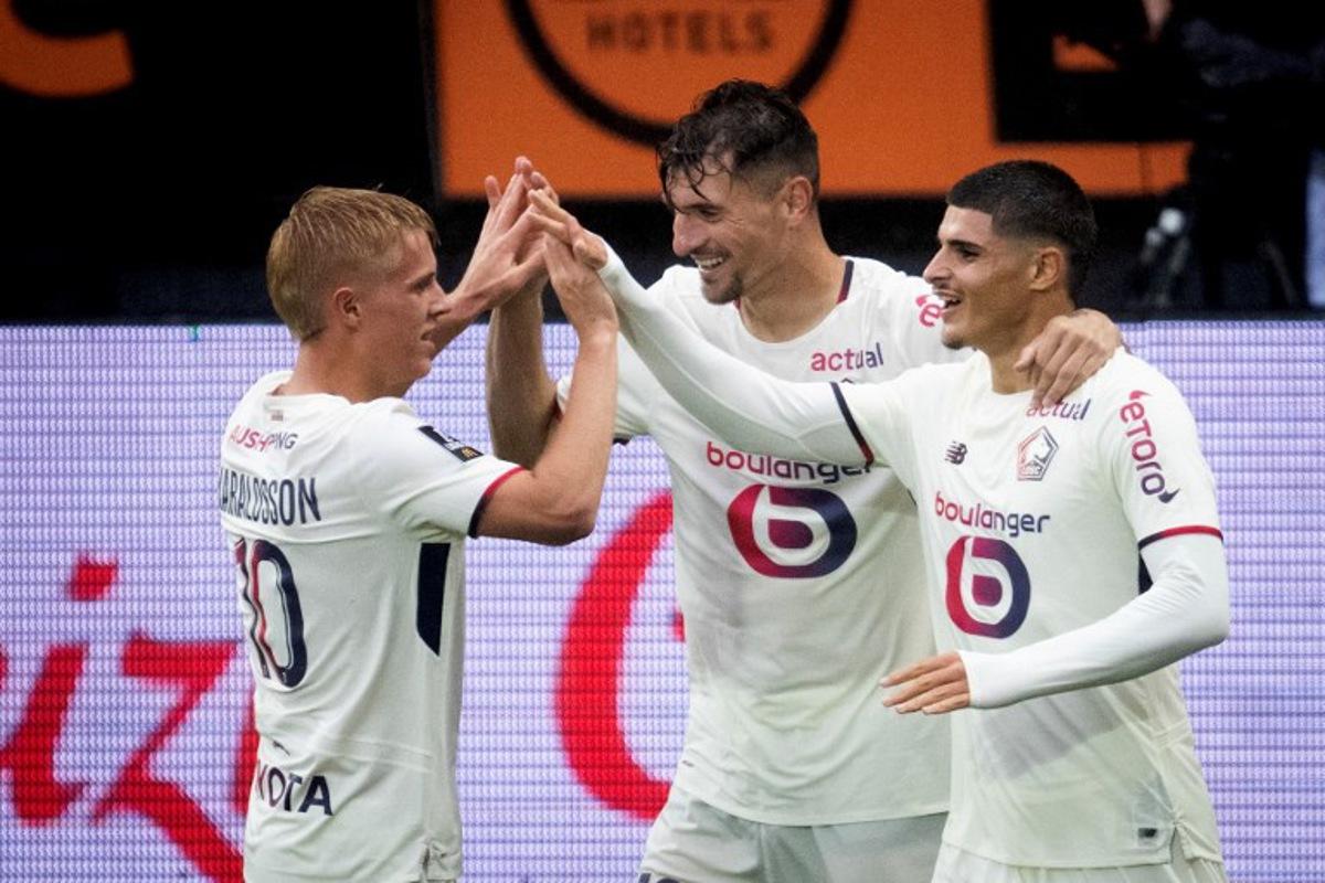 Lille's spanish forward #07 Matias Fernandez Pardo (R) celebrates with teammates after scoring his team's second goal during the French L1 football match between FC Lorient and lille OSC at Yves-Allainmat stadium in Lorient, western France on August 30, 2025. Loic VENANCE / AFP