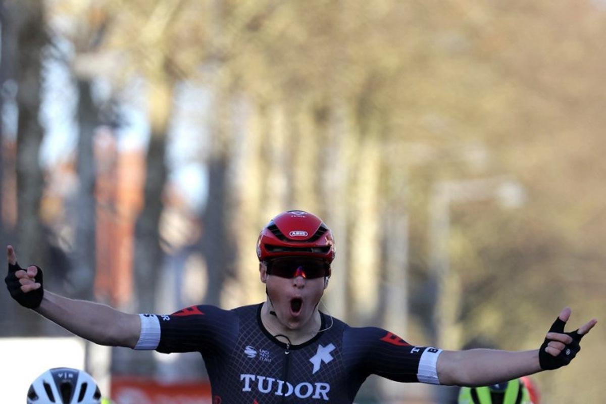 Tudor Pro Cycling Team's Dutch cyclist Arvid De Kleijn celebrates as he crosses the finish line during the 2nd stage of the Paris-Nice cycling race, 179 km between Thoiry and Montargis, on March 4, 2024. Thomas SAMSON / AFP