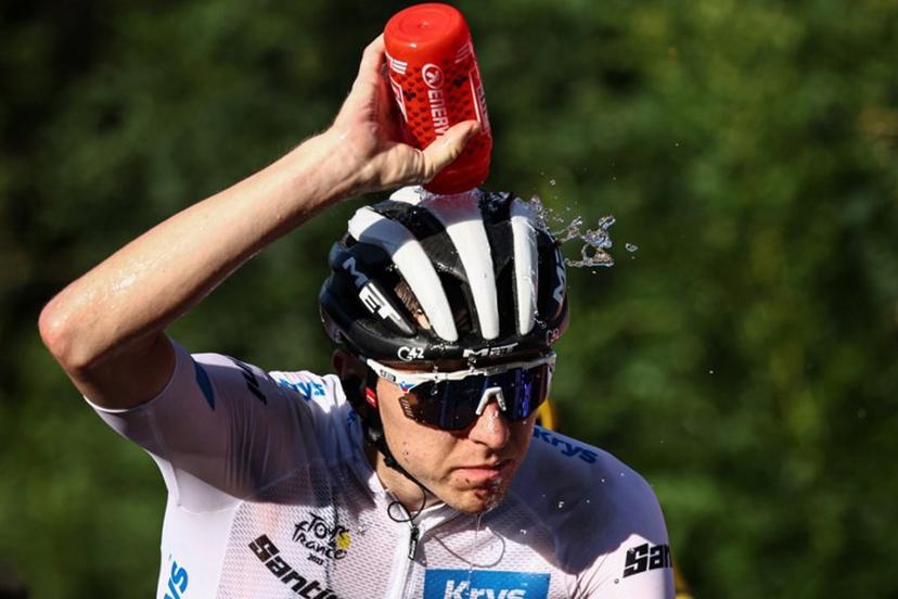 UAE Team Emirates' Slovenian rider Tadej Pogacar wearing the best young rider's white jersey douses himself with water to cool down as he cycles in the final ascent of Saint-Gervais-les-Bains in the last kilometers of the 15th stage of the 110th edition of the Tour de France cycling race, 179 km between Les Gets Les Portes du Soleil and Saint-Gervais Mont-Blanc, in the French Alps, on July 16, 2023. Anne-Christine POUJOULAT / AFP
