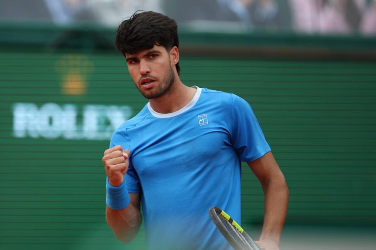 Spain's Carlos Alcaraz reacts as he plays against Italy's Jannik Sinner during the Monte Carlo ATP Masters Series Tournament final tennis match on Court Rainier III at the Monte-Carlo Country Club in Roquebrune-Cap-Martin, south-eastern France on April 12, 2026. Valery HACHE / AFP