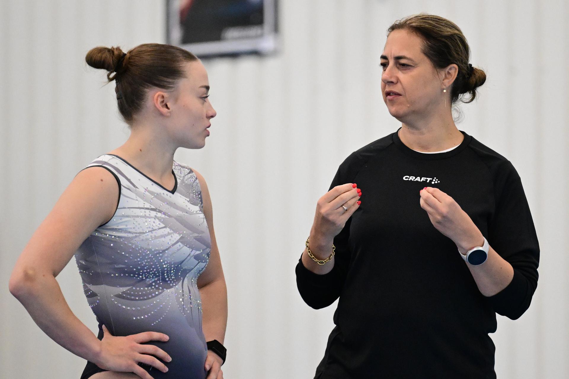 Belgian gymnast Jade Vansteenkiste and coach Valerie Van Cauwenberghe pictured during a training session of Belgium's artistic gymnastics team, Wednesday 7 October 2026, in Gent, ahead of the Worlds Championships in Rotterdam from 17 to 25 October 2026. BELGA PHOTO DIRK WAEM
