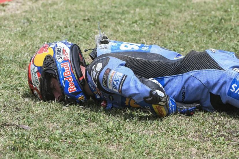 Team Gresini Racing MotoGP's Alex Marquez lies on the side of the track after crashing at high speed during the 2026 Catalunya Moto GP Grand Prix at the Catalunya racetrack in Montmelo, near Barcelona, on May 17, 2026. JOSE JORDAN / AFP