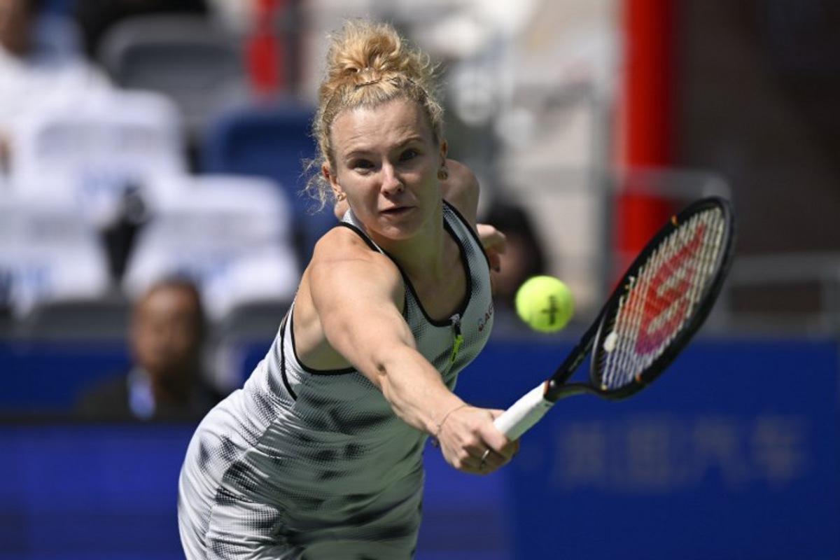 Czech Republic's Katerina Siniakova hits a return to Russia's Liudmila Samsonova during their women's singles match at the Wuhan Open tennis tournament in Wuhan, China's Hubei province on October 13, 2026. WANG Zhao / AFP