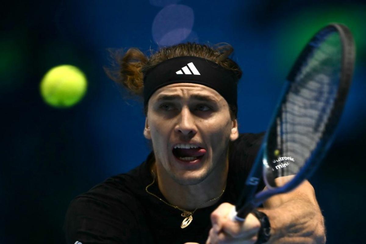Germany's Alexander Zverev hits the ball during his match against USA's Ben Shelton at the ATP Finals tennis tournament in Turin on November 9, 2025. Marco BERTORELLO / AFP