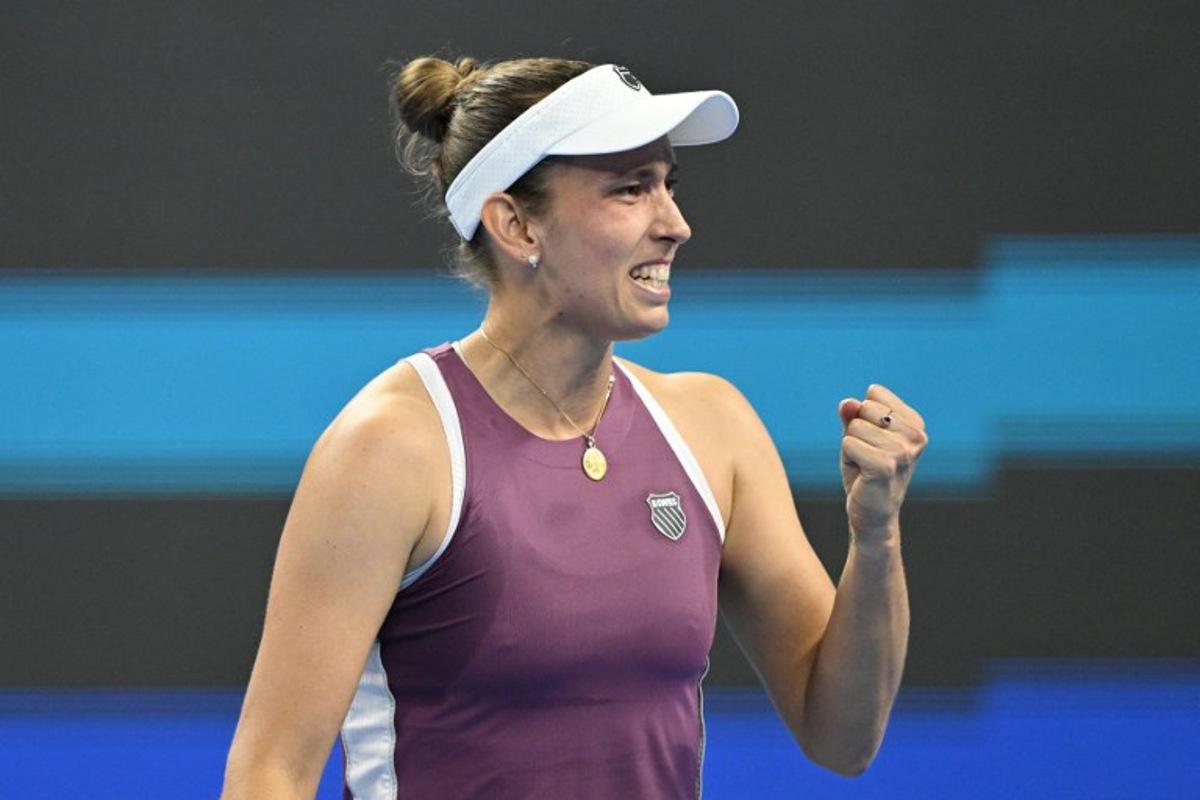 Belgium's Elise Mertens reacts after beating Poland's Iga Swiatek in their women's singles quarter-final at the China Open tennis tournament in Beijing on October 9, 2026. GREG BAKER / AFP