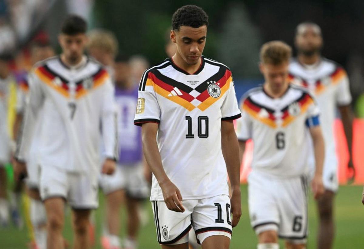 Germany's midfielder #10 Jamal Musiala reacts after losing the penalty shootout during the 2026 World Cup round of 32 football match between Germany and Paraguay at the Boston Stadium in Foxborough on June 29, 2026. MAURO PIMENTEL / AFP