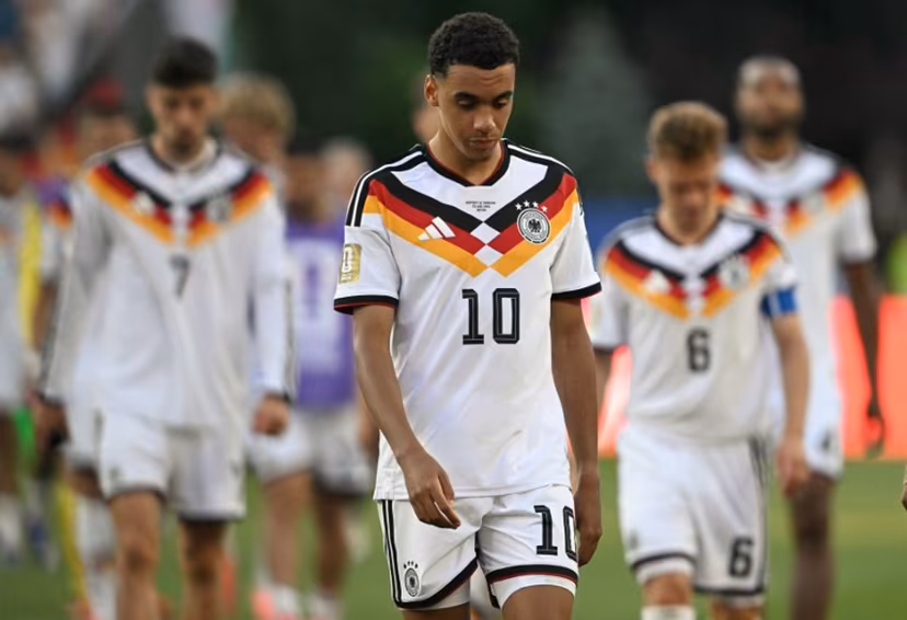 Germany's midfielder #10 Jamal Musiala reacts after losing the penalty shootout during the 2026 World Cup round of 32 football match between Germany and Paraguay at the Boston Stadium in Foxborough on June 29, 2026. MAURO PIMENTEL / AFP