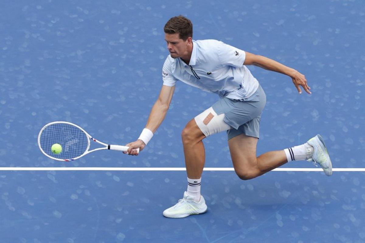 Belgium's Alexander Blockx hits a return to Argentina's Francisco Cerundolo in their men's singles round of 16 tennis match on day nine of the US Open tennis tournament at the USTA Billie Jean King National Tennis Center in New York on September 7, 2026. KENA BETANCUR / AFP