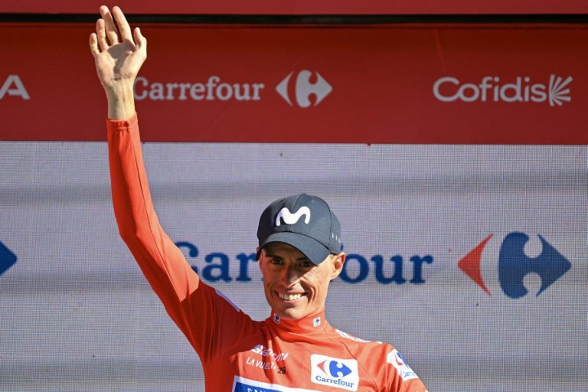 Team Movistar's Spanish rider Enric Mas celebrates reatining the overall race lead on the podium after the 18th stage of the Vuelta a Espana 2026 cycling tour, a 32,1 km individual time-trial race between El Puerto de Santa Maria and Jerez de la Frontera, on September 10, 2026. JORGE GUERRERO / AFP
